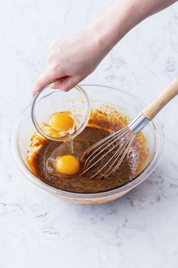 Add room temperature egg and egg yolk to sugar/molasses/butter mixture.