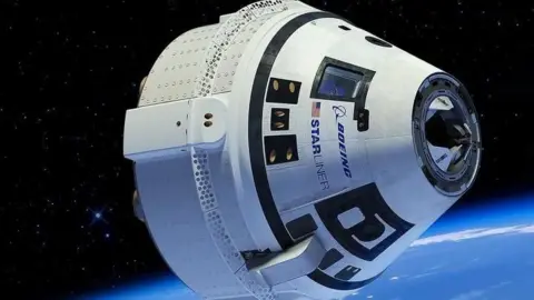 NASA The Starliner capsule in orbit. The edge of the Earth can be seen as a bluish haze in the bottom right hand part of the frame with the white conical capsule with a Boeing logo in the foreground.