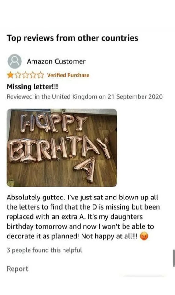 Amazon review with balloon letters spelling "HAPPY BIRHTAY" instead of "HAPPY BIRTHDAY"; user notes missing 'D'