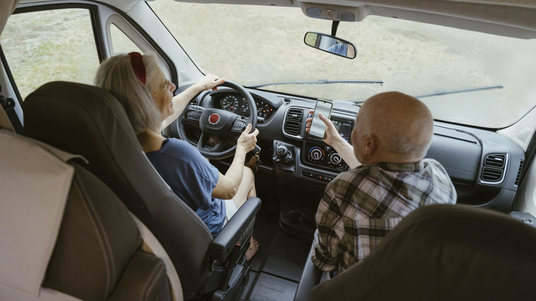 Older couple driving their motor home