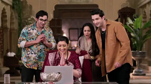 jiostar Picture of Tulsi with her children in a still from Kyunki Saas bhi kabhi bahu thi
